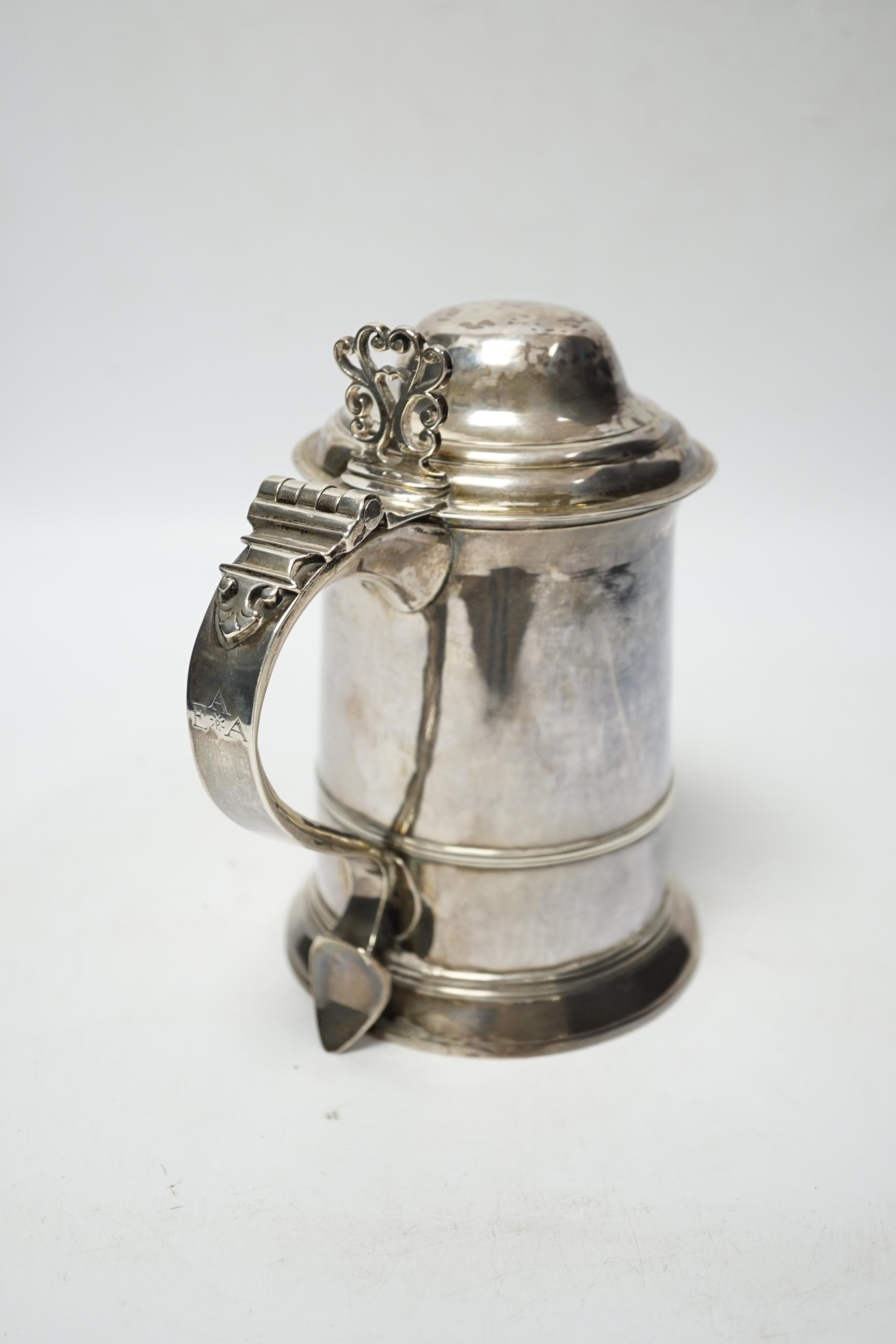 A George III silver tankard, with banded girdle, makers mark on lid and base differ?, London, 1784, height 17.5cm, 17.6oz. (a.f.)
